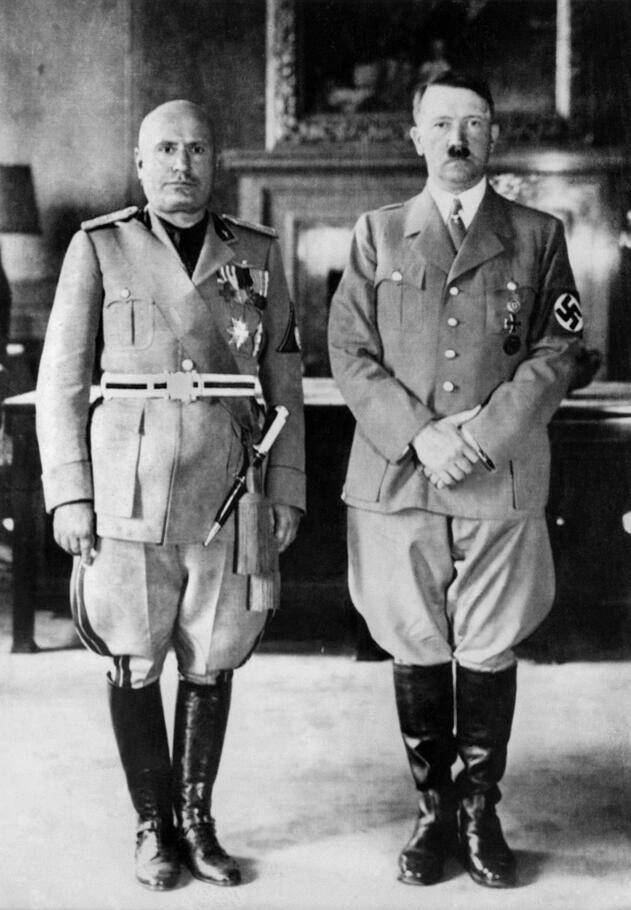 A picture of Hitler and Mussolini standing together.